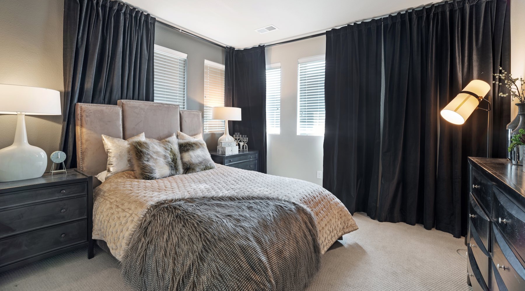 a bedroom with a bed and two nightstands